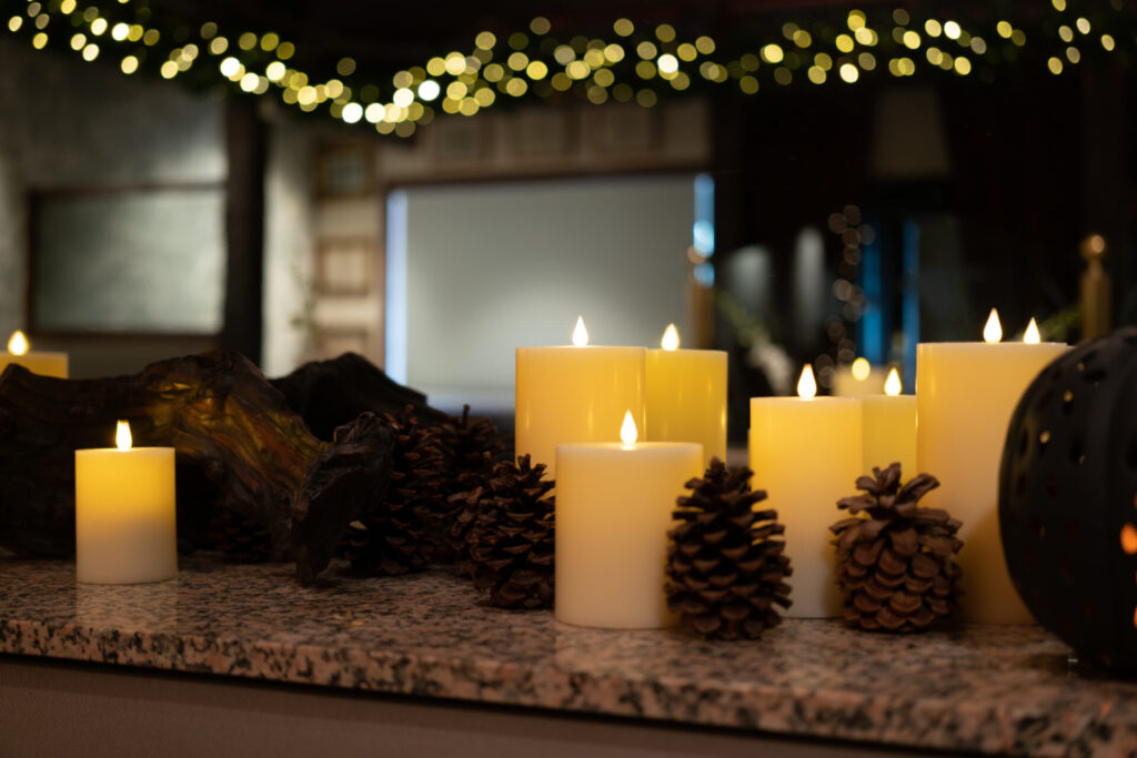 Candles and pinecones along the bar at Le Sanglier
