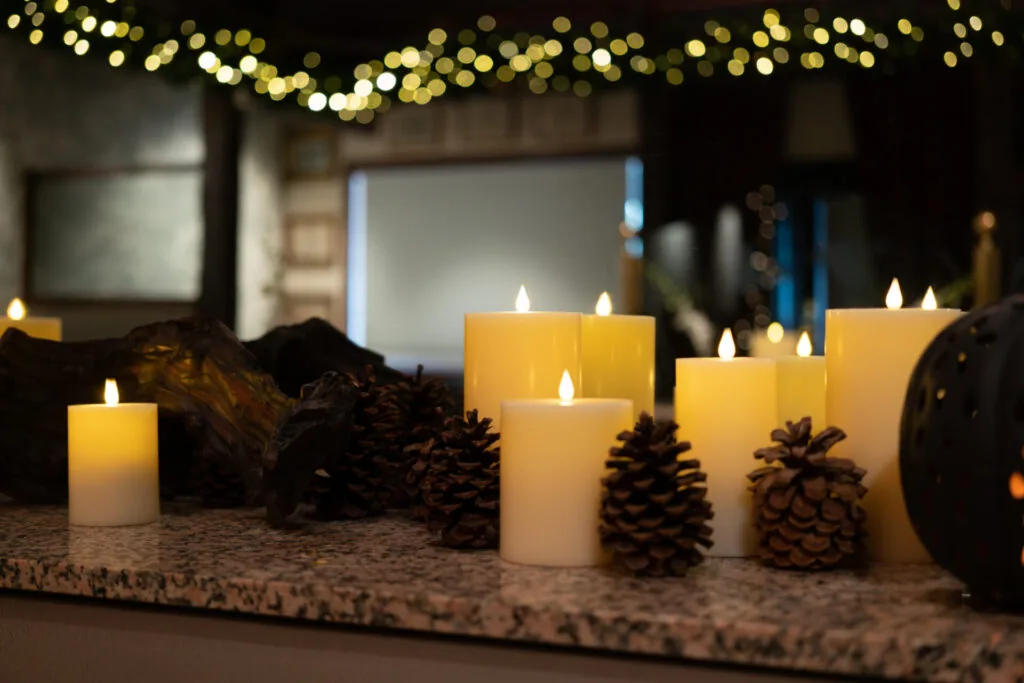 Candles and pinecones along the bar at Le Sanglier