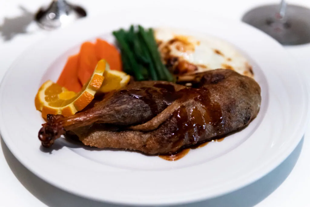 Roasted crispy half duckling a l orange