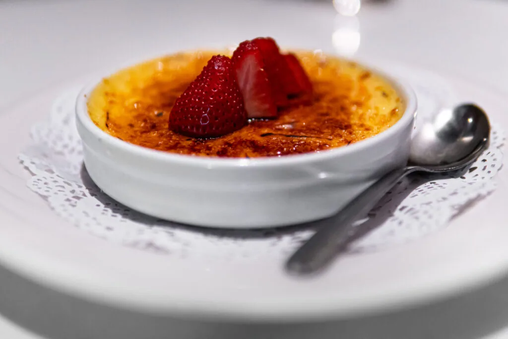 Creme brulee topped with strawberries